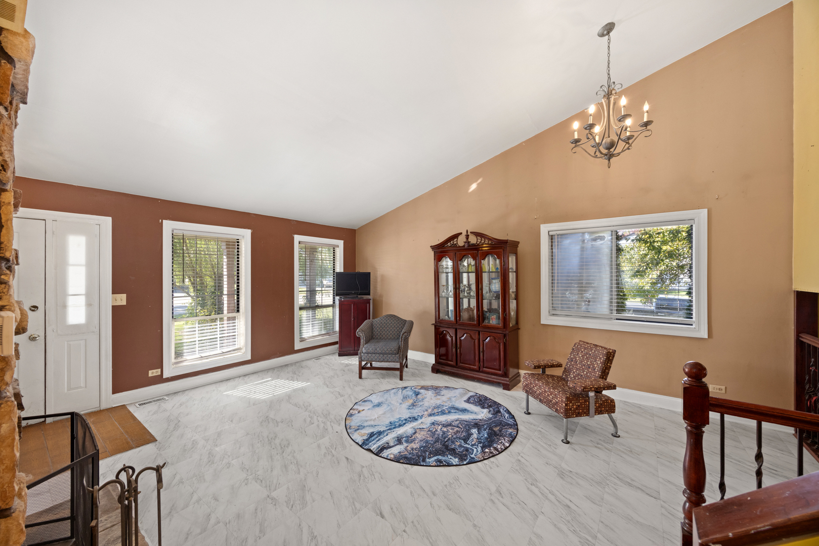 1256 Concord Drive Elgin, IL 60120 - Photo 5 of 22 a living room with furniture a window and a chandelier