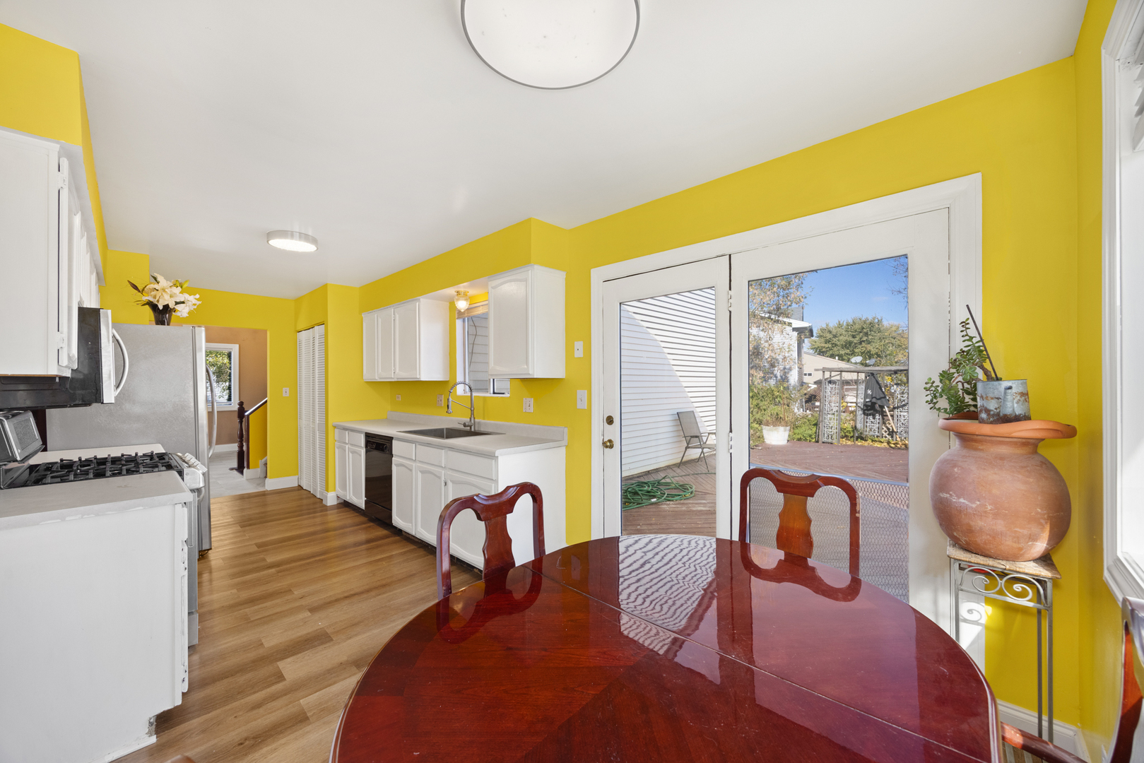 1256 Concord Drive Elgin, IL 60120 - Photo 8 of 22 a view of a kitchen and dining room