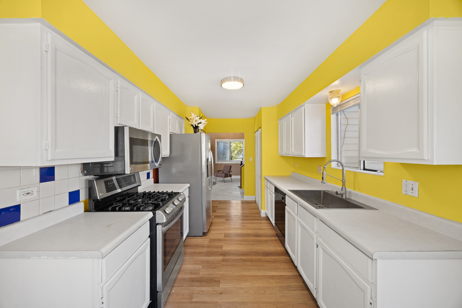 1256 Concord Drive Elgin, IL 60120 - Photo 9 of 22 a kitchen with stainless steel appliances a sink stove and cabinets