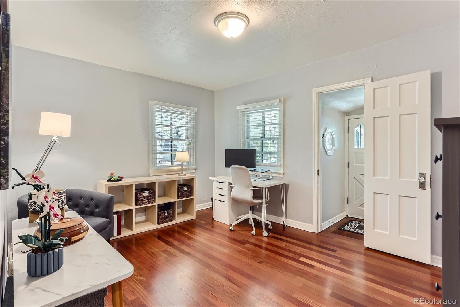 753 Cherry Street Denver, CO 80220 - Photo 15 of 37 a living room with furniture and a wooden floor