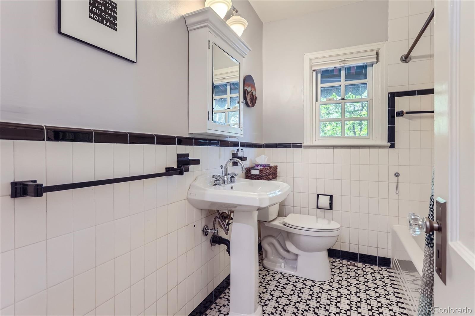 753 Cherry Street Denver, CO 80220 - Photo 19 of 37 a bathroom with a sink toilet and shower