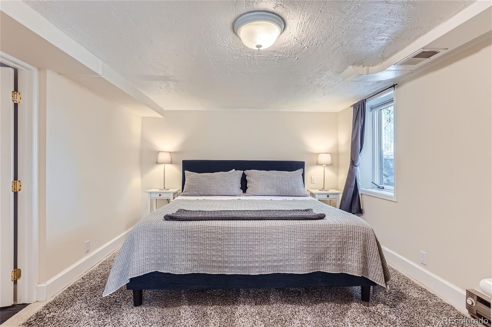 753 Cherry Street Denver, CO 80220 - Photo 20 of 37 a bedroom with a bed and window