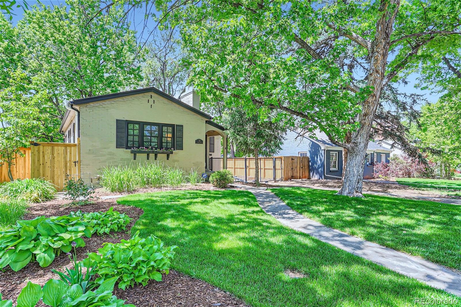 753 Cherry Street Denver, CO 80220 - Photo 2 of 37 a backyard of a house with lots of green space