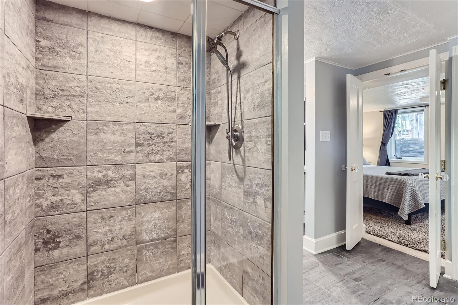 753 Cherry Street Denver, CO 80220 - Photo 22 of 37 a bathroom with a shower