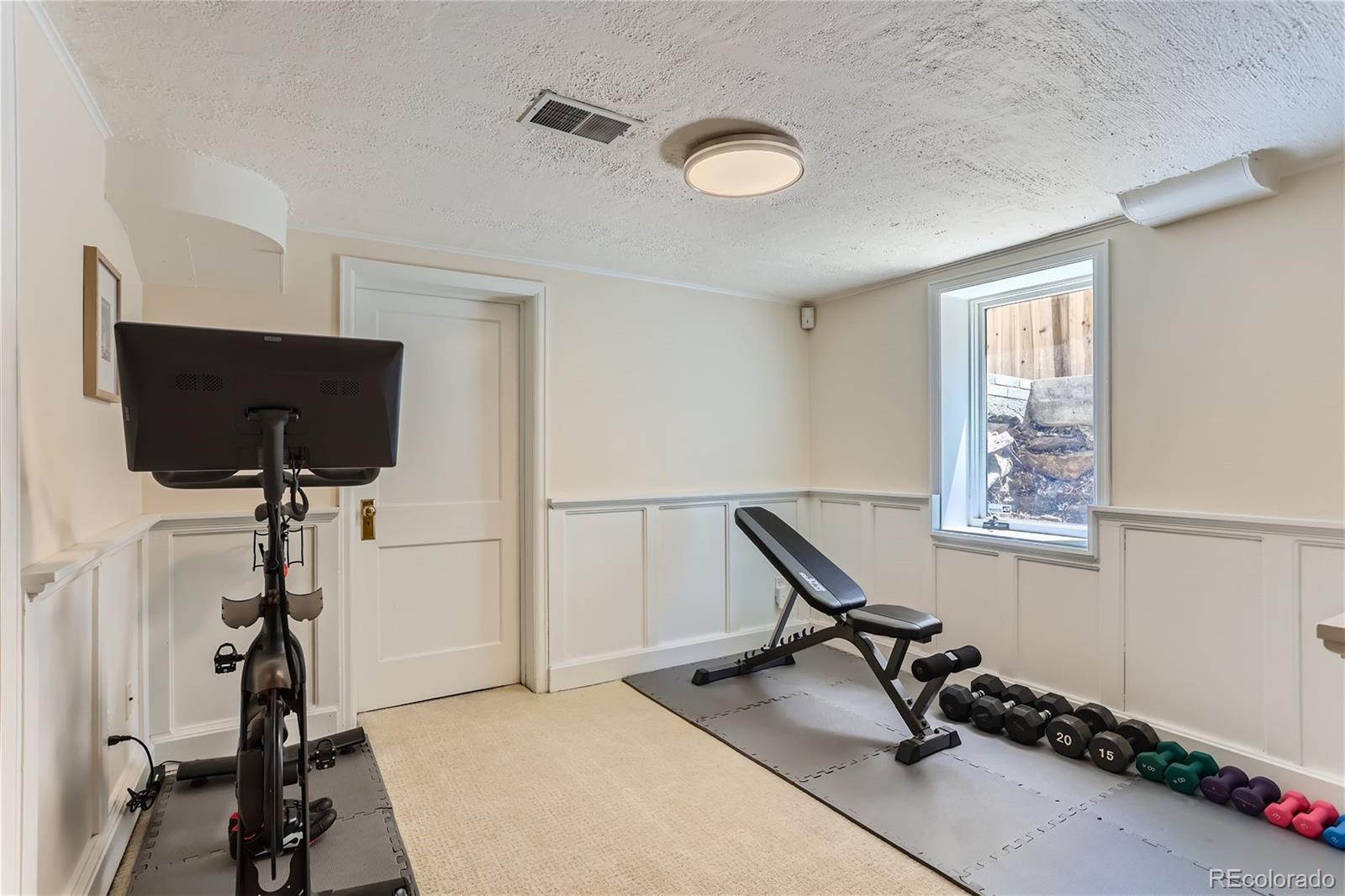753 Cherry Street Denver, CO 80220 - Photo 26 of 37 a living room with furniture and a flat screen tv