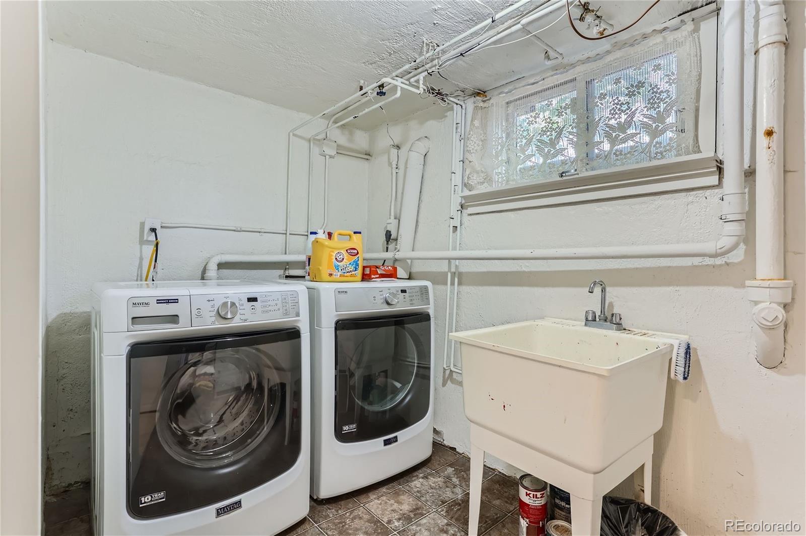 753 Cherry Street Denver, CO 80220 - Photo 28 of 37 a utility room with dryer and washer