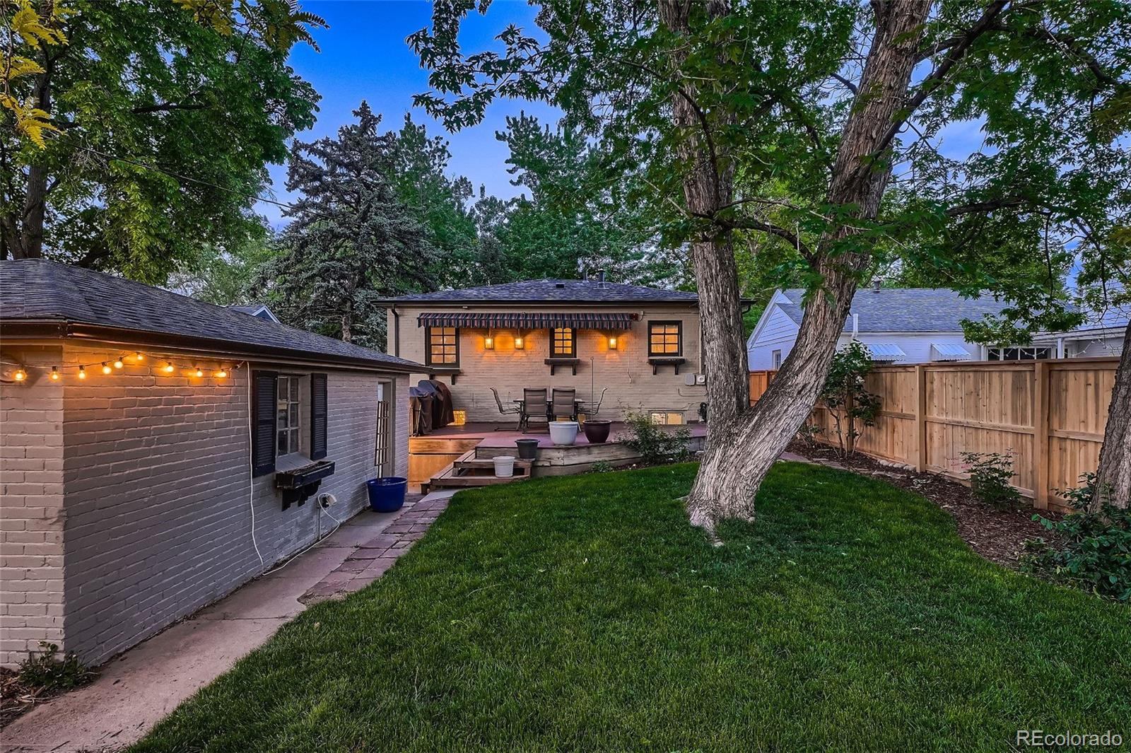 753 Cherry Street Denver, CO 80220 - Photo 33 of 37 a view of a chair and table in the back yard of the house