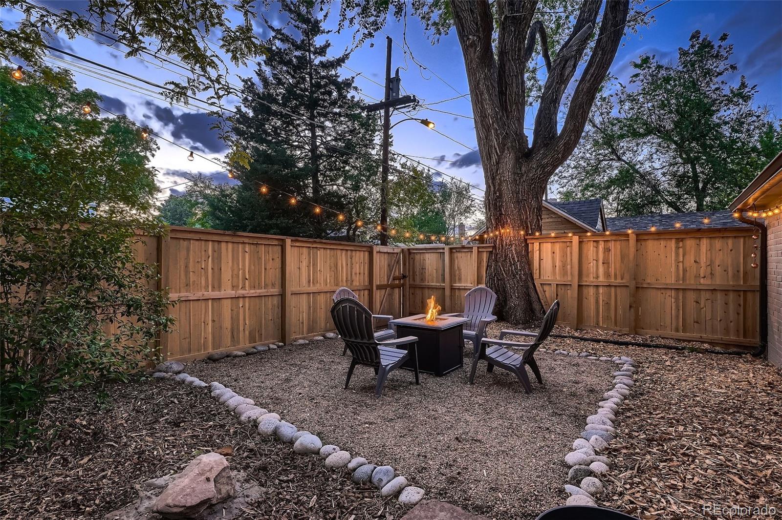 753 Cherry Street Denver, CO 80220 - Photo 35 of 37 a backyard of a house with table and chairs