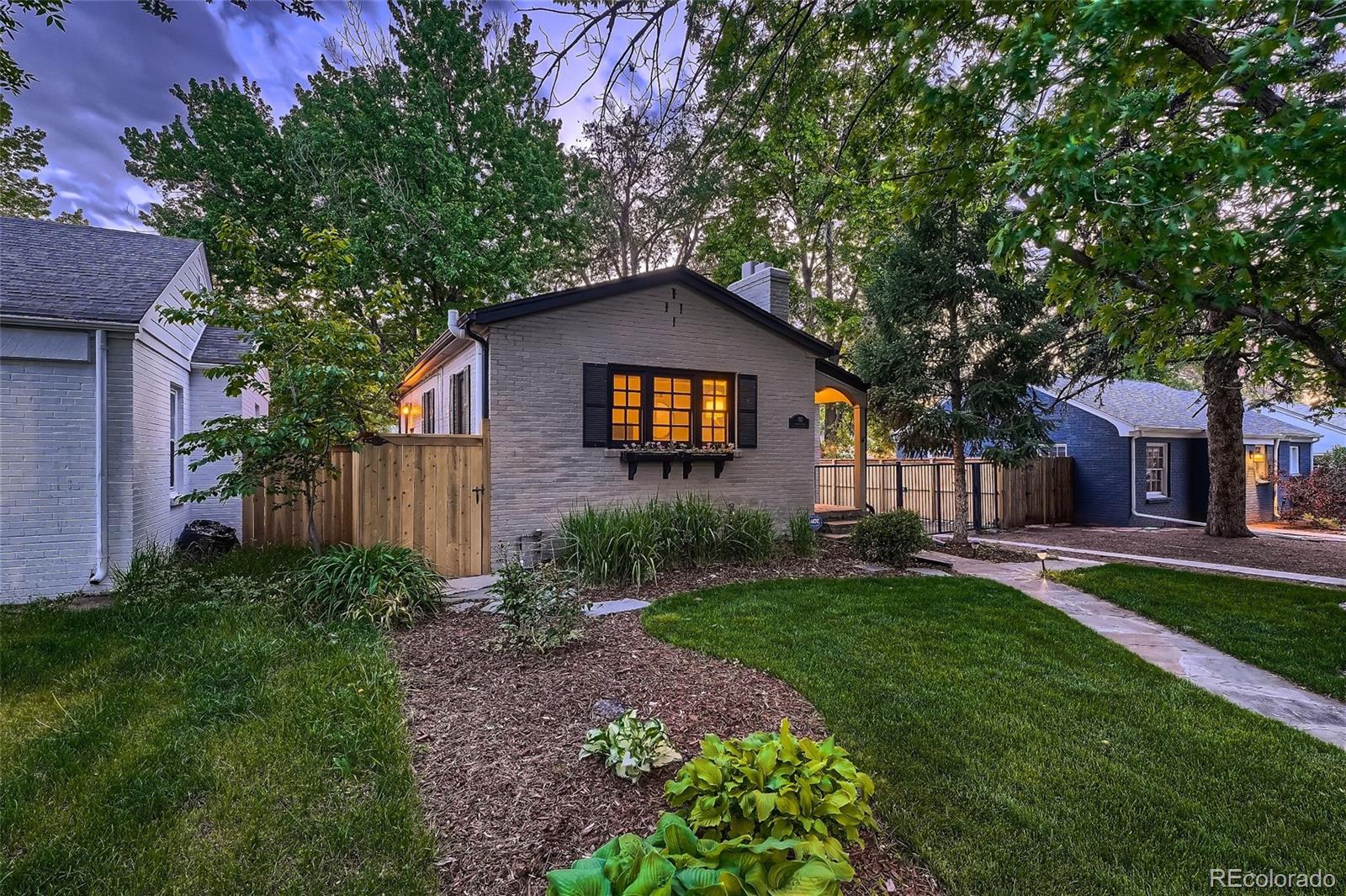 753 Cherry Street Denver, CO 80220 - Photo 5 of 37 a front view of a house with garden