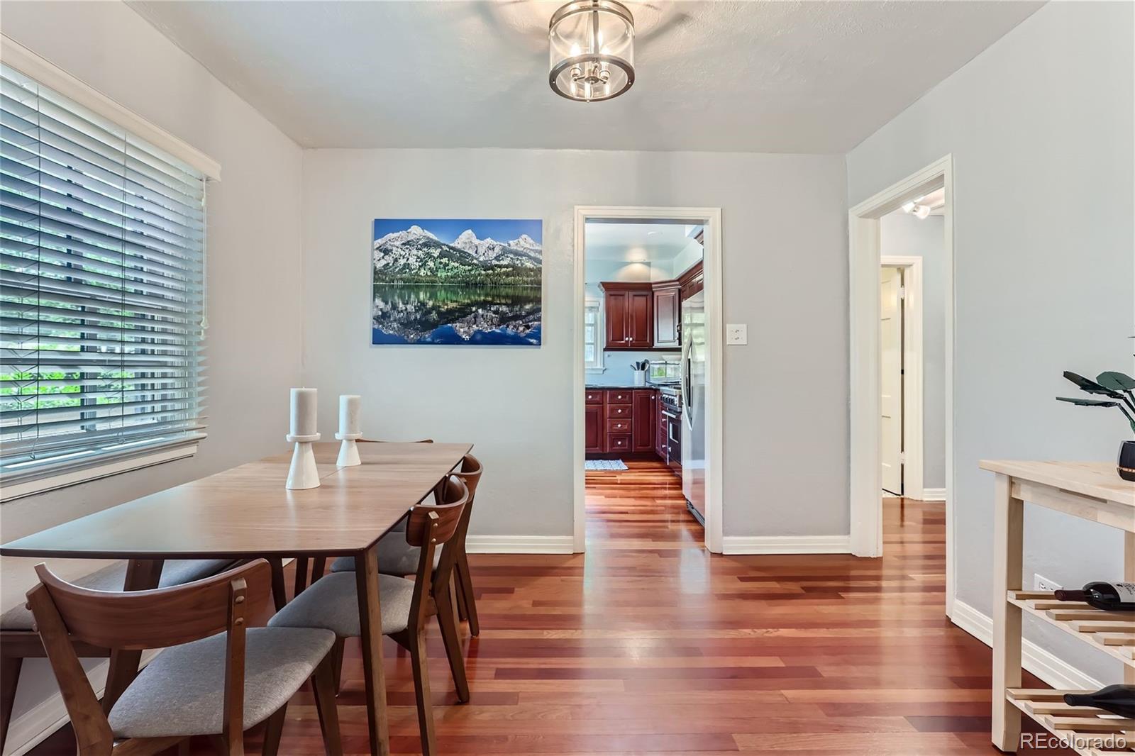 753 Cherry Street Denver, CO 80220 - Photo 9 of 37 a view of a dining room with furniture and wooden floor