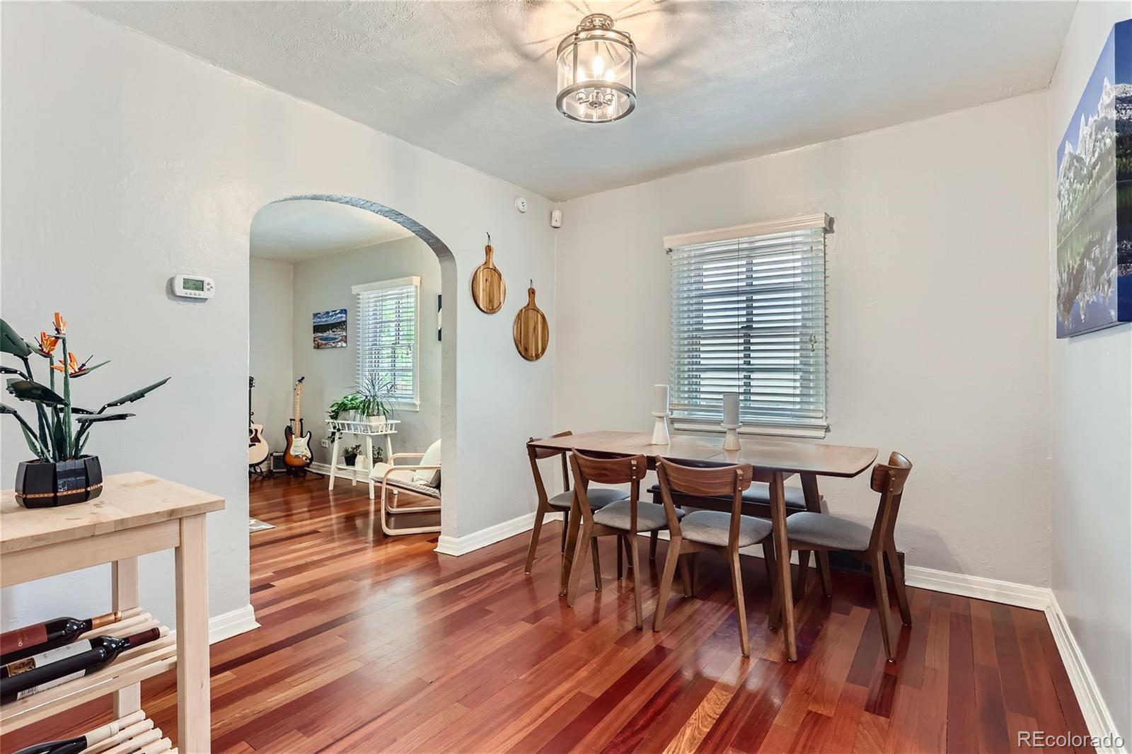 753 Cherry Street Denver, CO 80220 - Photo 10 of 37 a view of a dining room with furniture window and wooden floor