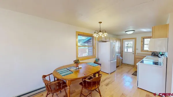 a kitchen with stainless steel appliances granite countertop a refrigerator and a stove