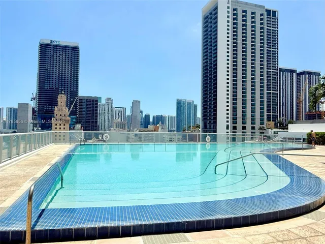 a view of swimming pool from a balcony