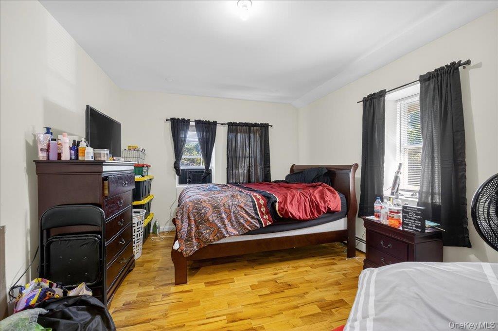 431 Gate Hill Coop Road Stony Point, NY 10980 - Photo 21 of 41 Bedroom featuring light wood-type flooring and multiple windows