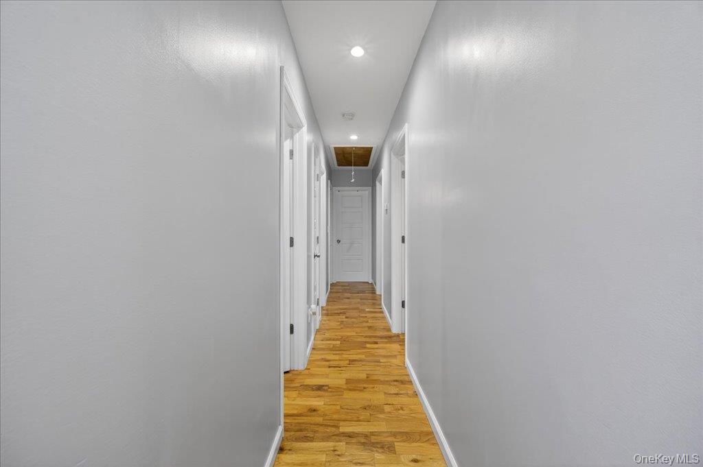 431 Gate Hill Coop Road Stony Point, NY 10980 - Photo 26 of 41 Hallway with attic access, light wood finished floors, and recessed lighting