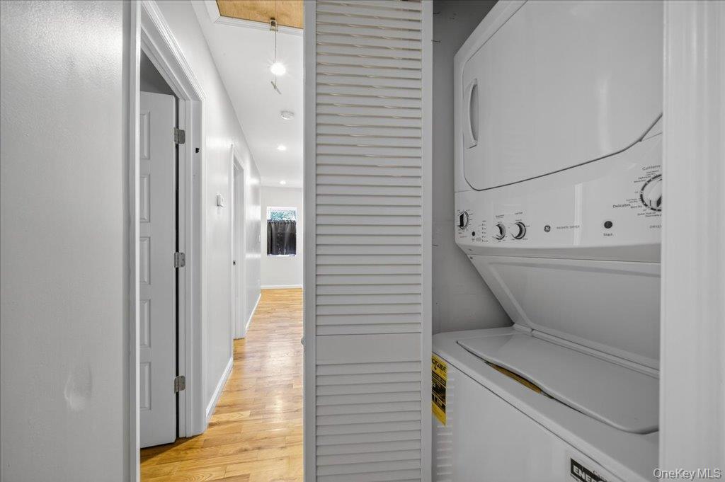 431 Gate Hill Coop Road Stony Point, NY 10980 - Photo 28 of 41 Washroom with light wood-style floors, stacked washing machine and dryer, and recessed lighting