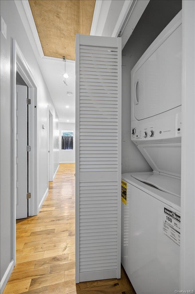 431 Gate Hill Coop Road Stony Point, NY 10980 - Photo 29 of 41 Laundry area with stacked washer / drying machine and light wood-style floors