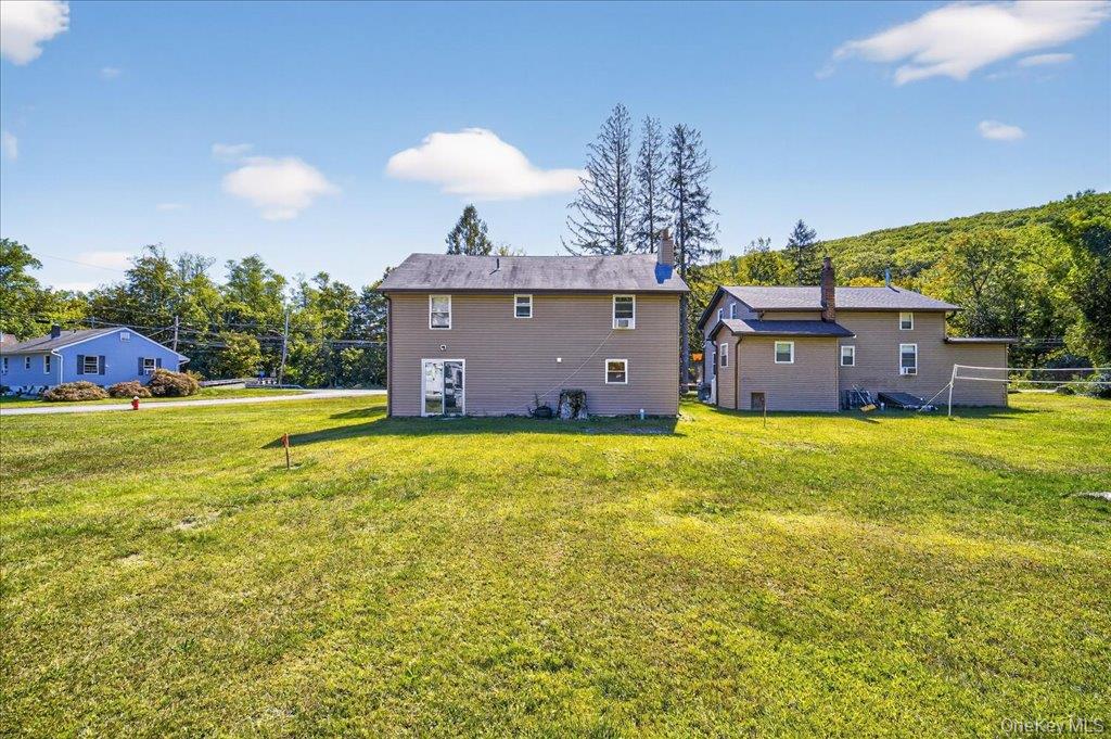 431 Gate Hill Coop Road Stony Point, NY 10980 - Photo 34 of 41 Rear view of house with a yard and a chimney