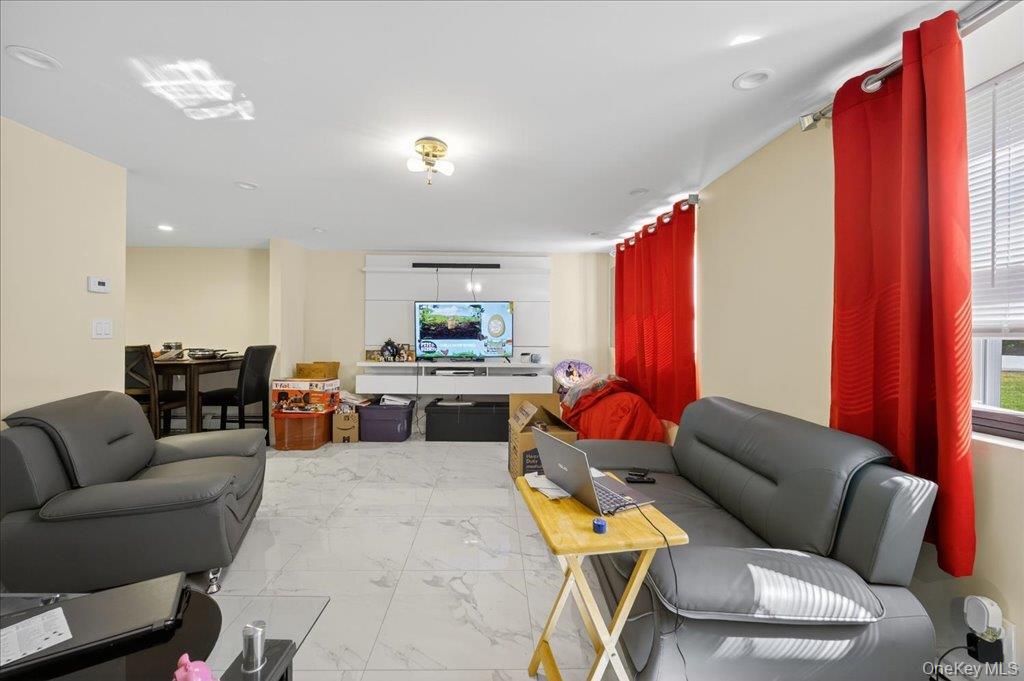 431 Gate Hill Coop Road Stony Point, NY 10980 - Photo 7 of 41 Living room featuring marble look tiles, recessed lighting, and plenty of natural light