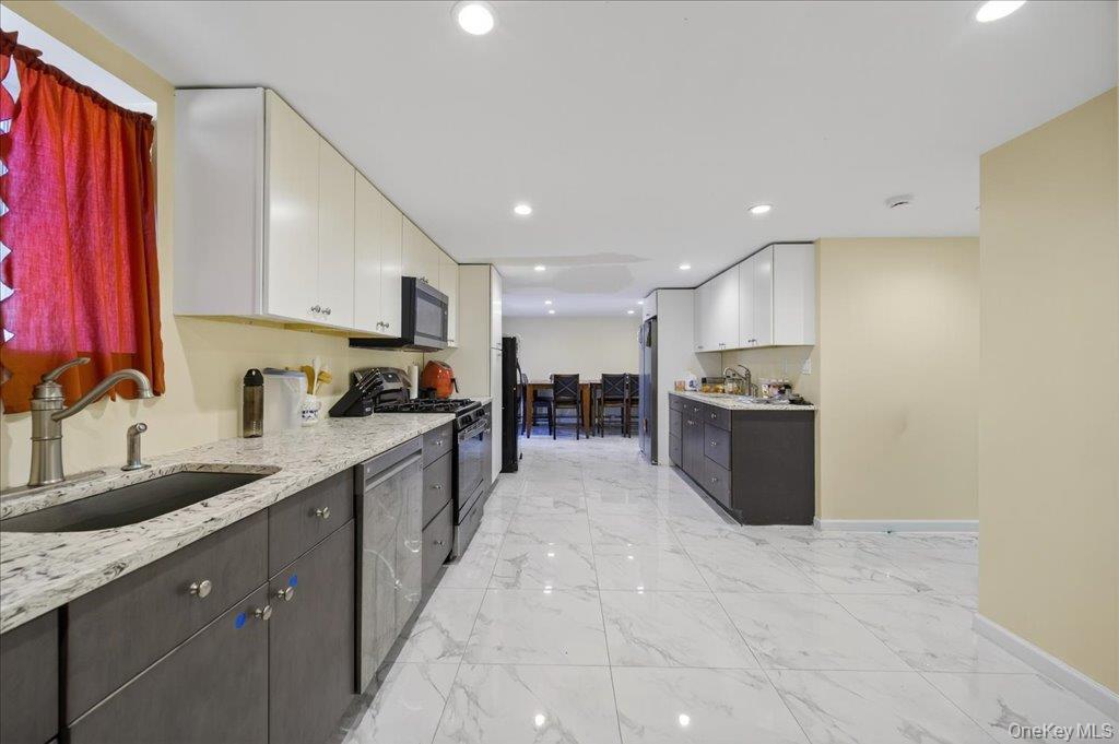 431 Gate Hill Coop Road Stony Point, NY 10980 - Photo 9 of 41 Kitchen featuring white cabinetry, black appliances, recessed lighting, light marble finish flooring, and light stone countertops