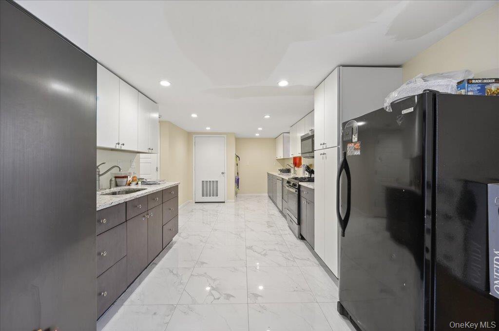 431 Gate Hill Coop Road Stony Point, NY 10980 - Photo 10 of 41 Kitchen with freestanding refrigerator, white cabinetry, recessed lighting, gas range, and stainless steel microwave