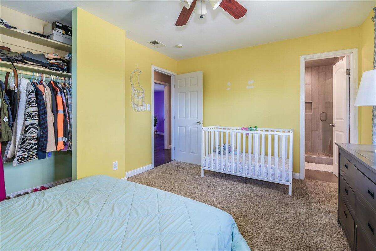 664 Moonglow Road Lompoc, CA 93436 - Photo 13 of 25 a bedroom with a bed and lamp