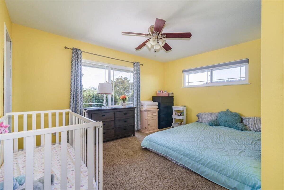 664 Moonglow Road Lompoc, CA 93436 - Photo 14 of 25 a bedroom with a bed and window