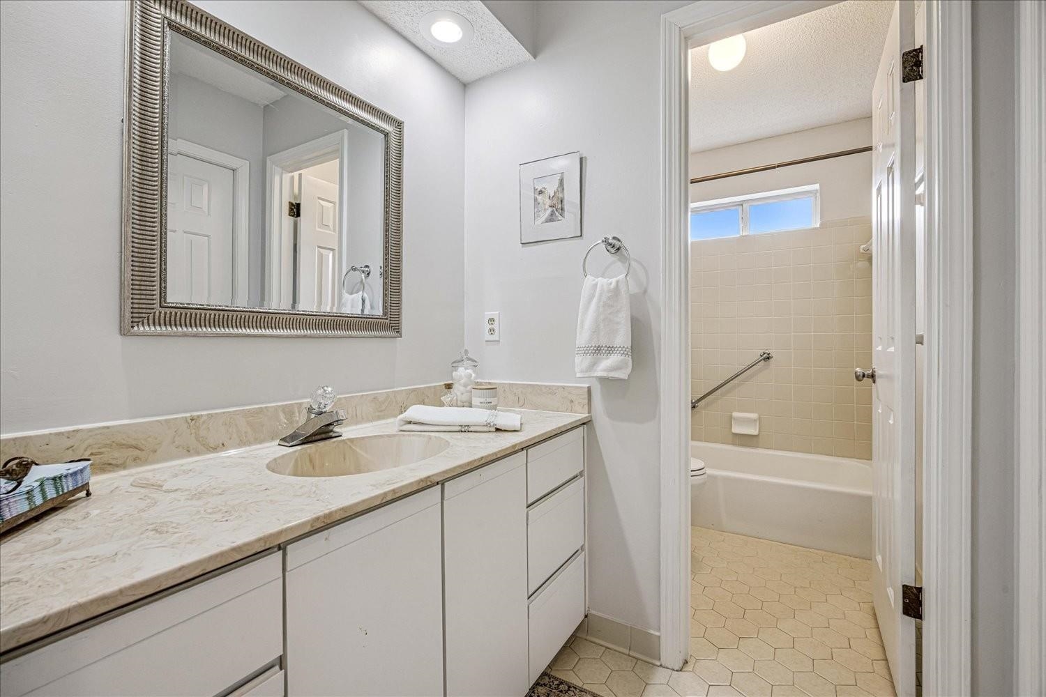 1893 Allenby Road Germantown, TN 38139 - Photo 19 of 31 a bathroom with a granite countertop sink and a mirror