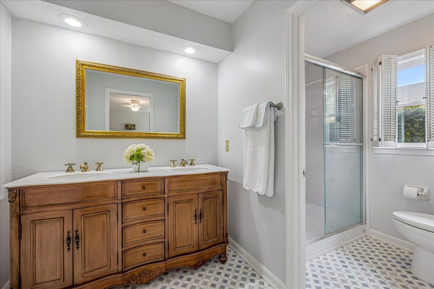 1893 Allenby Road Germantown, TN 38139 - Photo 21 of 31 a bathroom with a sink a toilet and shower