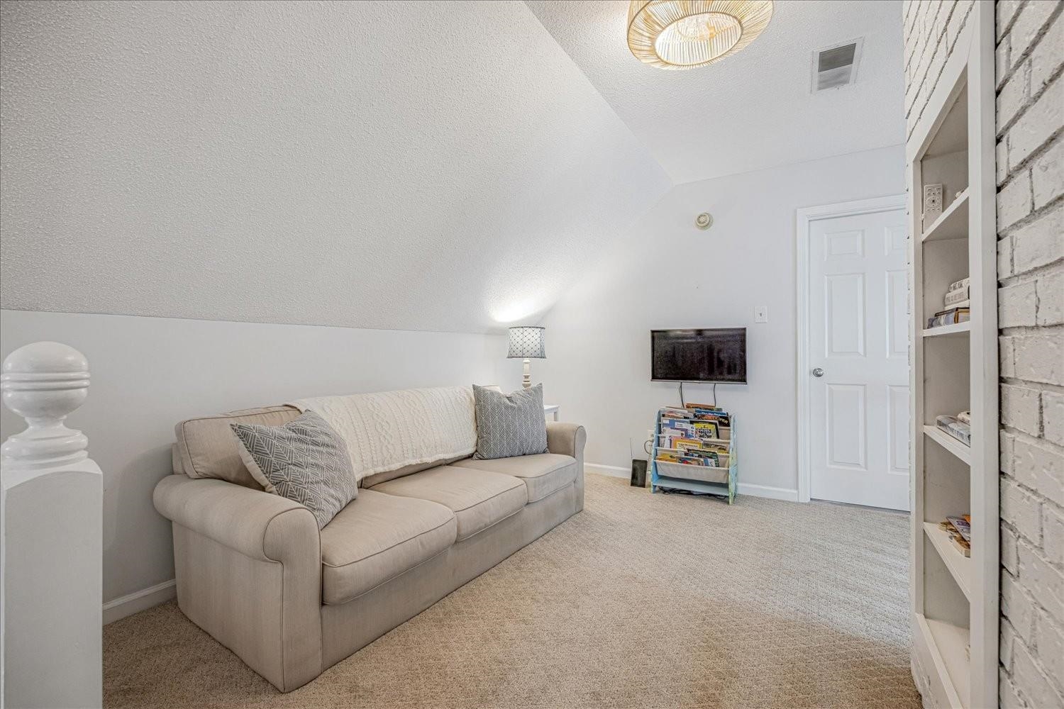 1893 Allenby Road Germantown, TN 38139 - Photo 24 of 31 a living room with furniture and a flat screen tv