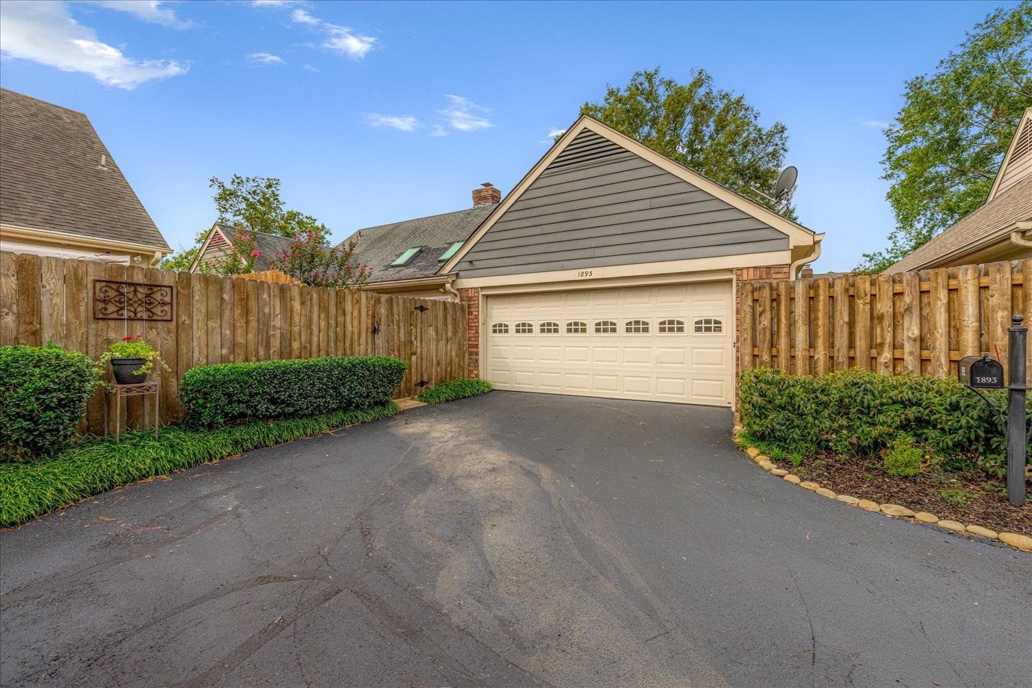1893 Allenby Road Germantown, TN 38139 - Photo 29 of 31 a view of a house with a yard and potted plants