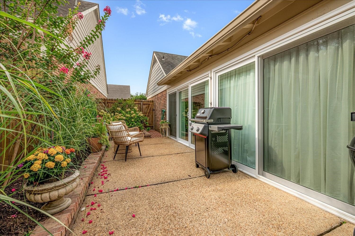 1893 Allenby Road Germantown, TN 38139 - Photo 30 of 31 a view of a patio with table and chairs and potted plants