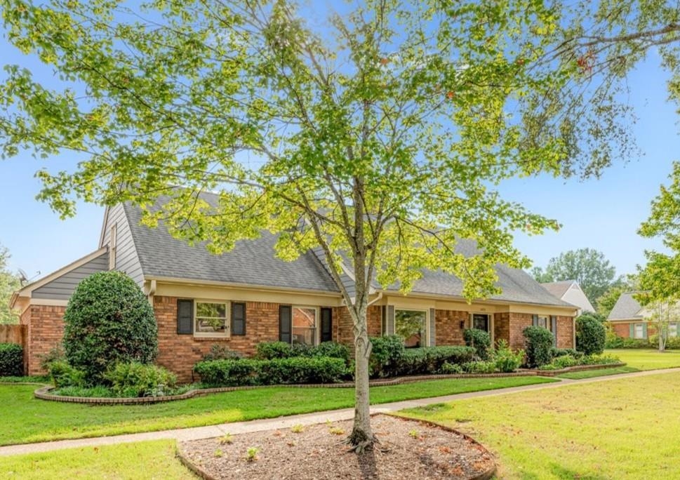 1893 Allenby Road Germantown, TN 38139 - Photo 4 of 31 a front view of a house with a garden
