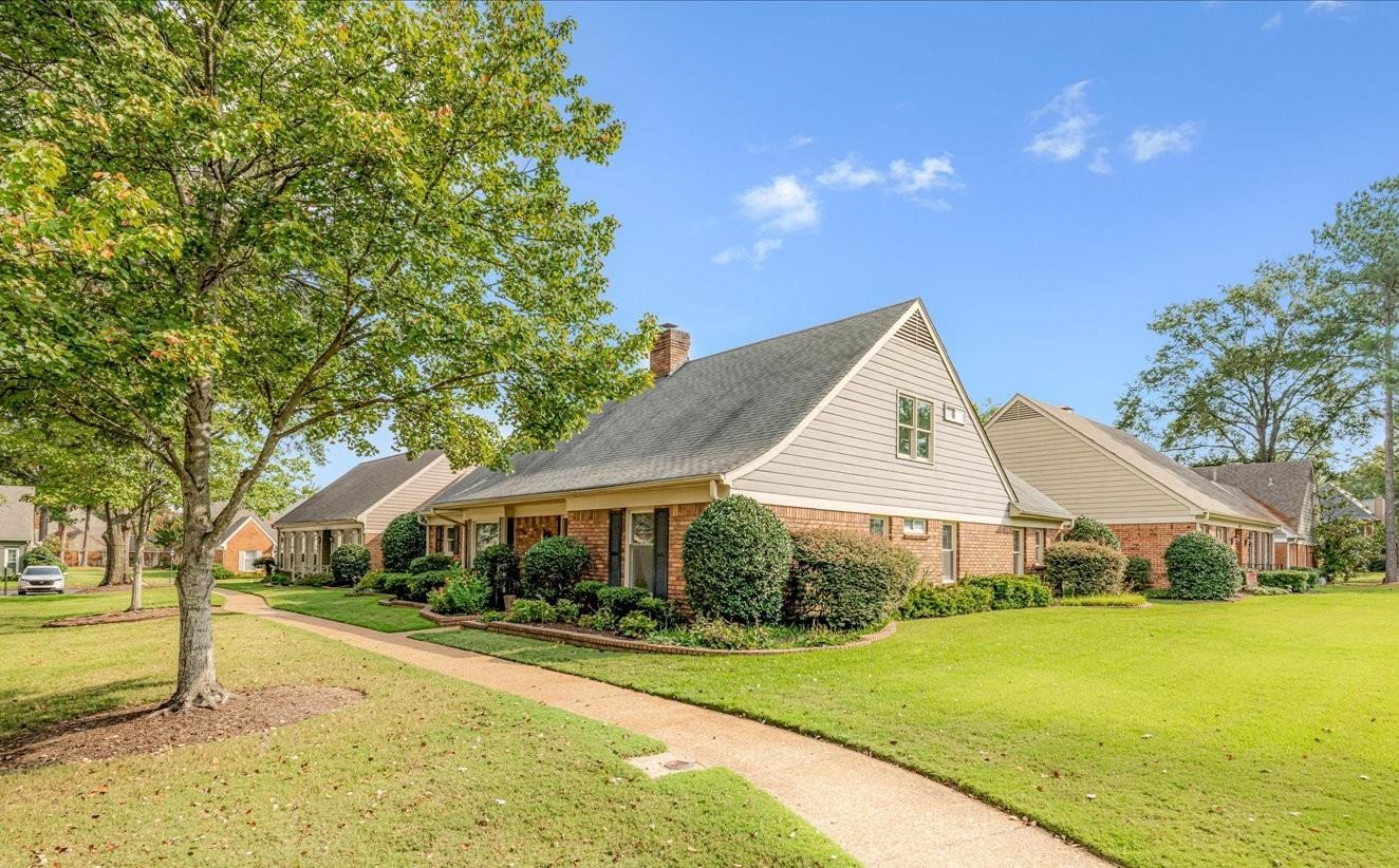 1893 Allenby Road Germantown, TN 38139 - Photo 5 of 31 a front view of house with yard and green space