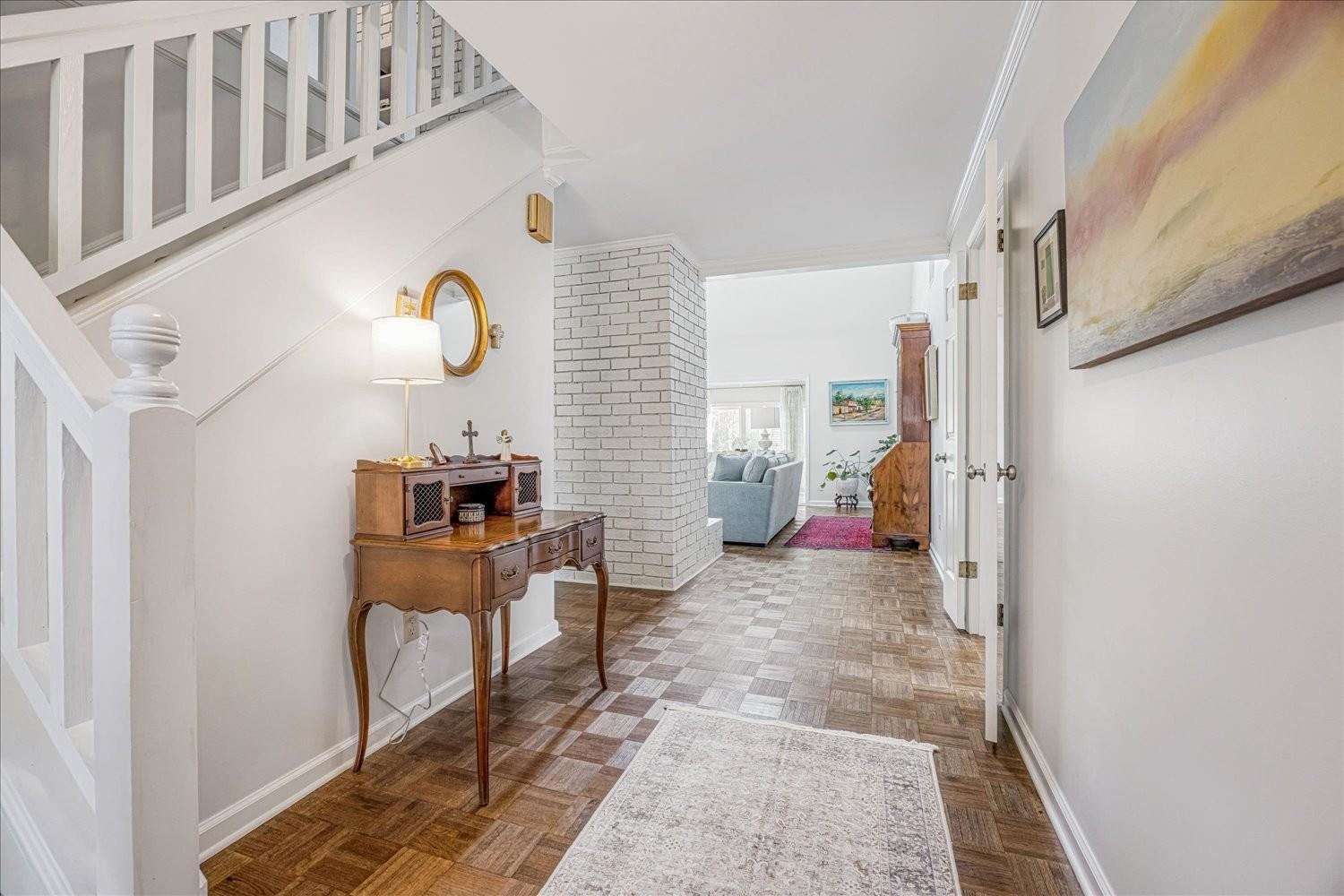 1893 Allenby Road Germantown, TN 38139 - Photo 7 of 31 a view of a hallway to a livingroom with furniture and windows
