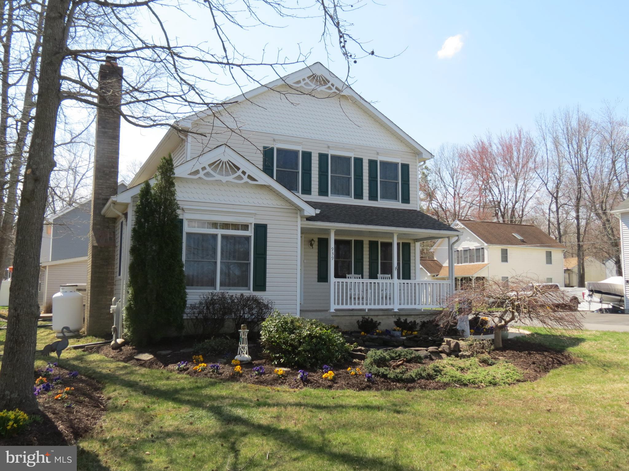 a backyard of a house with yard fire pit and outdoor seating