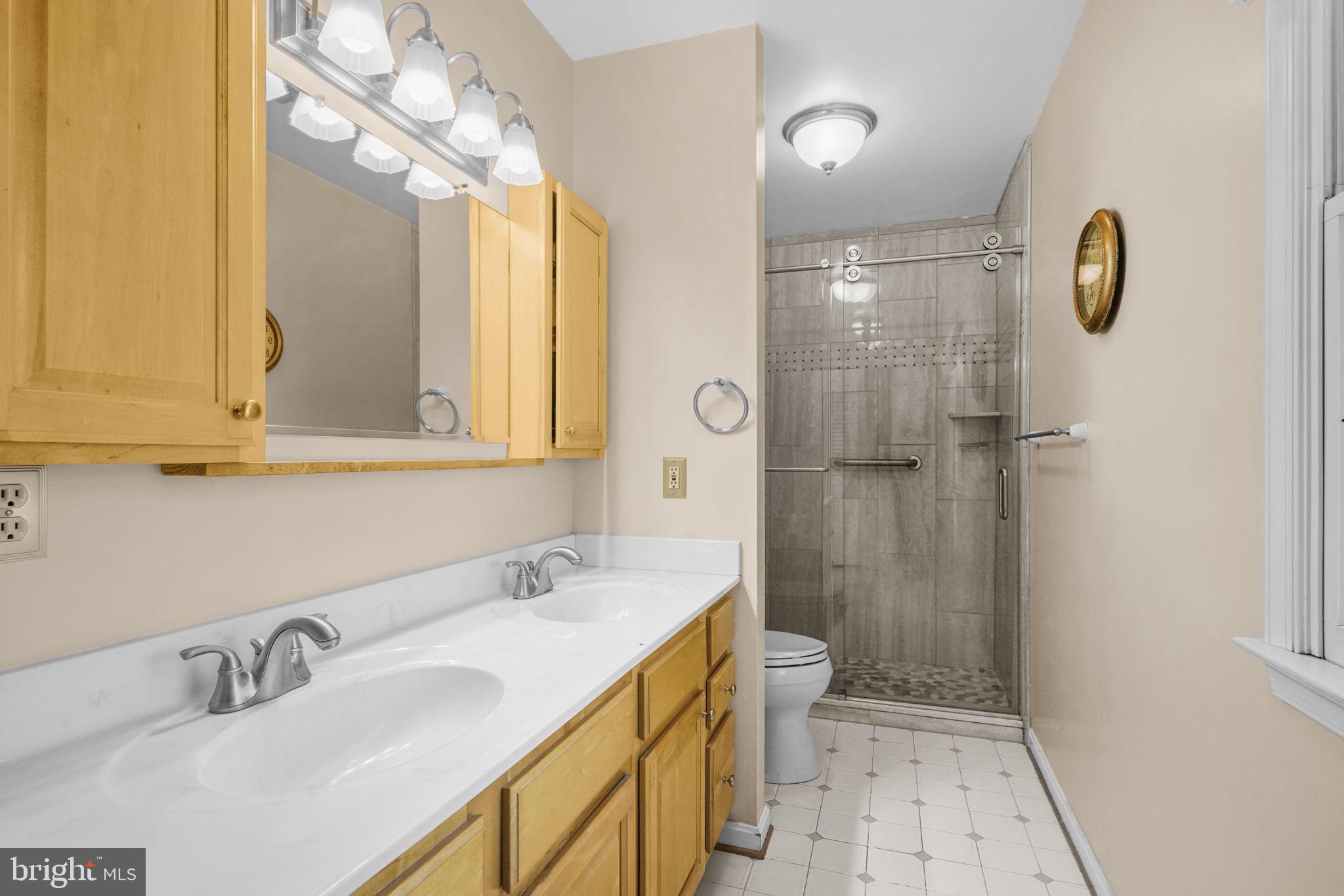 939 Main Street Deale, MD 20751 - Photo 24 of 33 a bathroom with a sink a toilet and shower