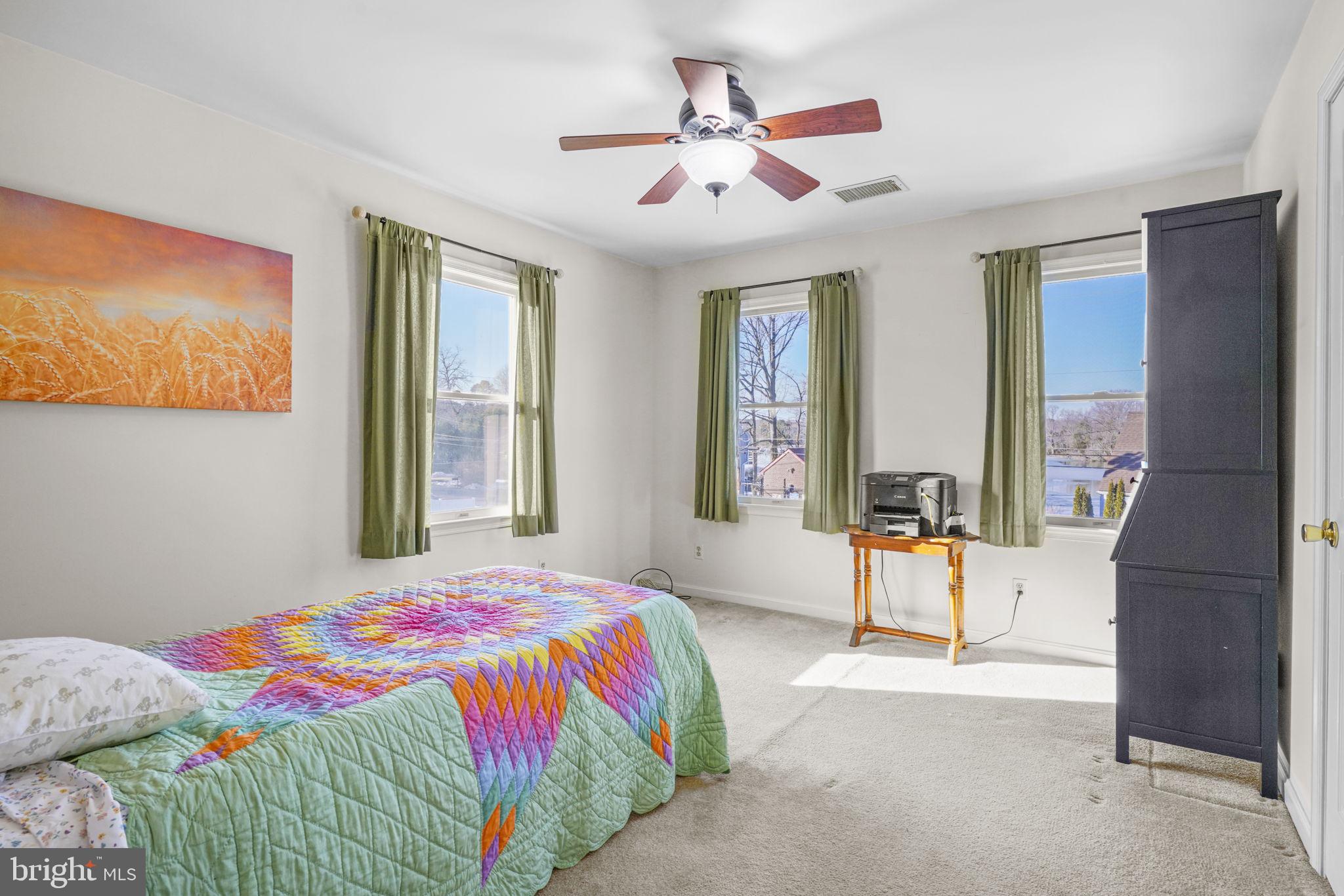 939 Main Street Deale, MD 20751 - Photo 26 of 33 a bedroom with a bed and a painting on the wall