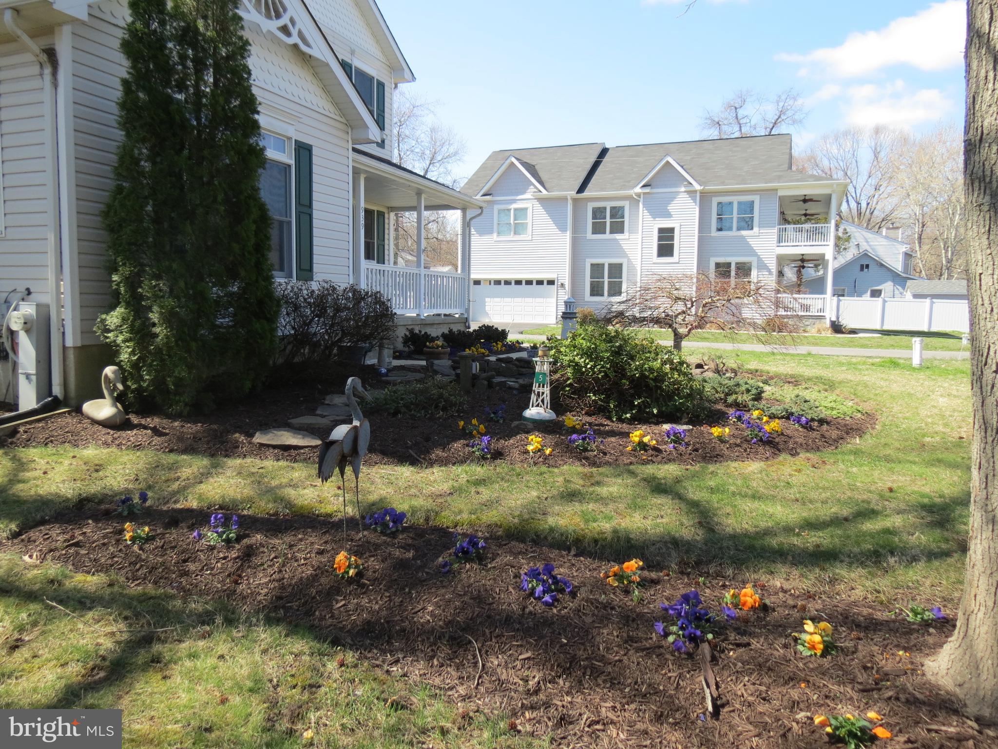 939 Main Street Deale, MD 20751 - Photo 3 of 37 a front view of a house with a yard table and chairs