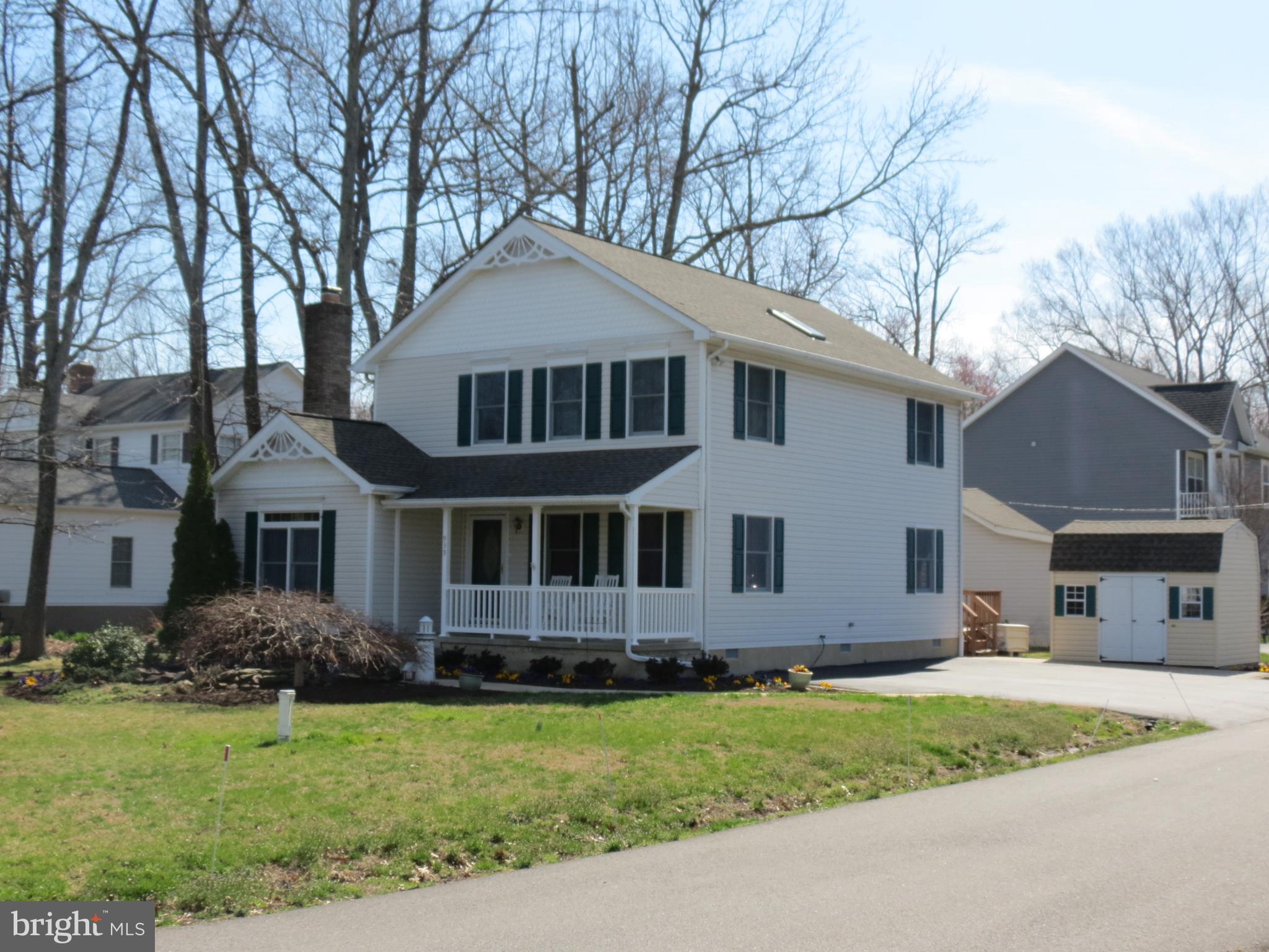 939 Main Street Deale, MD 20751 - Photo 31 of 37 a front view of a house with a garden