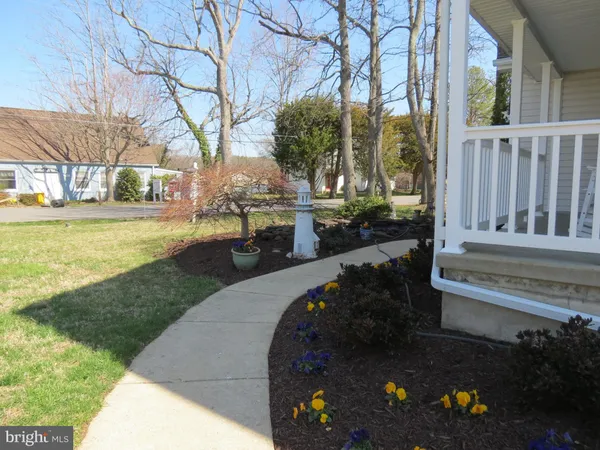 a view of a backyard with sitting area