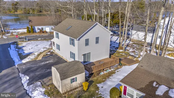 aerial view of a house with a yard