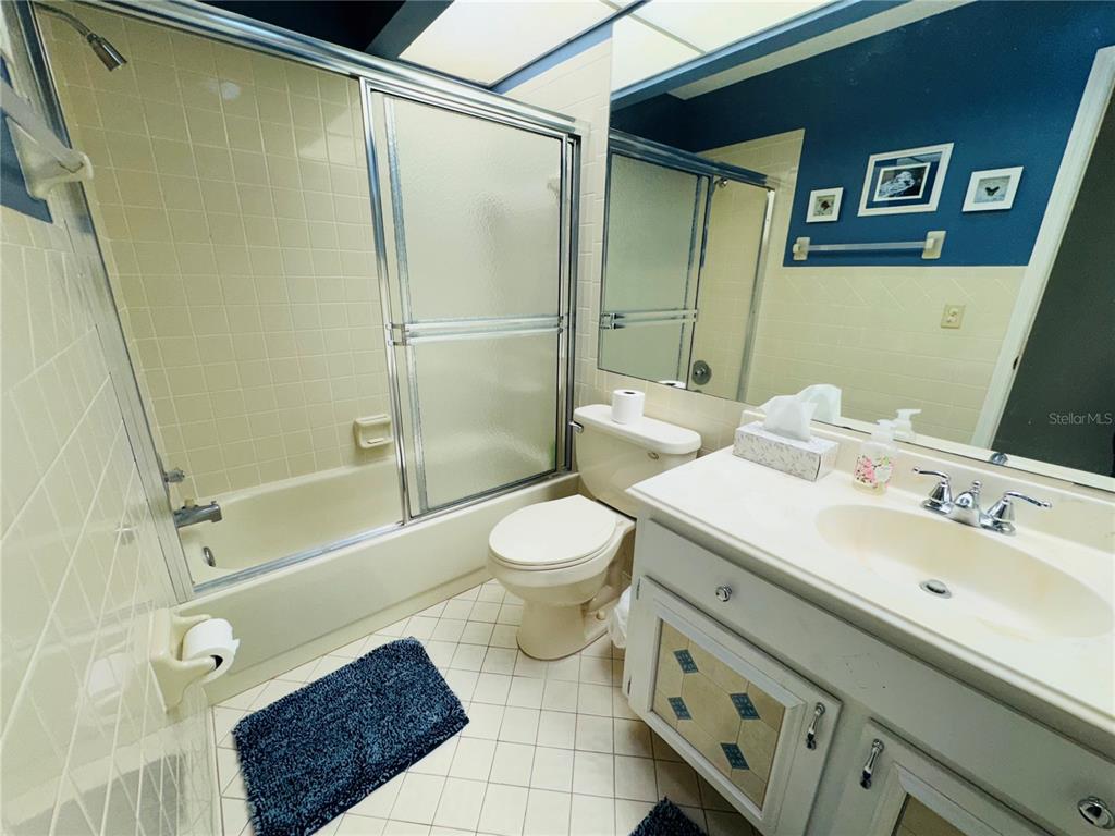 7559 Heather Walk Drive Weeki Wachee, FL 34613 - Photo 14 of 26 a bathroom with a sink a toilet and shower