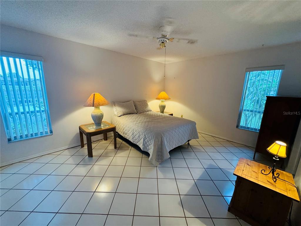 7559 Heather Walk Drive Weeki Wachee, FL 34613 - Photo 15 of 26 a bedroom with a bed and a window