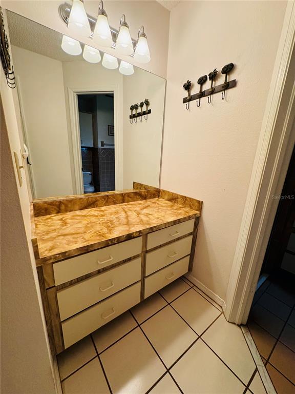 7559 Heather Walk Drive Weeki Wachee, FL 34613 - Photo 17 of 26 a bathroom with a sink vanity and a mirror