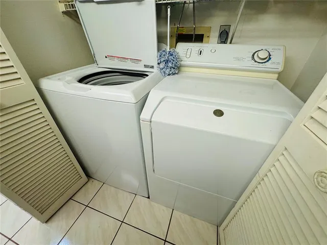a view of lake with green space and bench