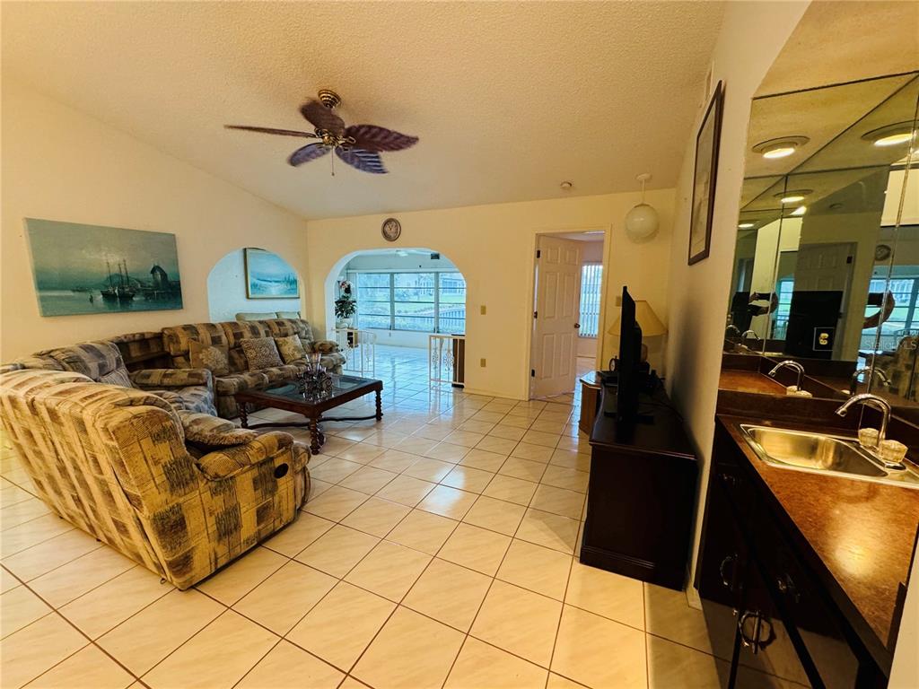 7559 Heather Walk Drive Weeki Wachee, FL 34613 - Photo 5 of 26 a living room with furniture and a flat screen tv