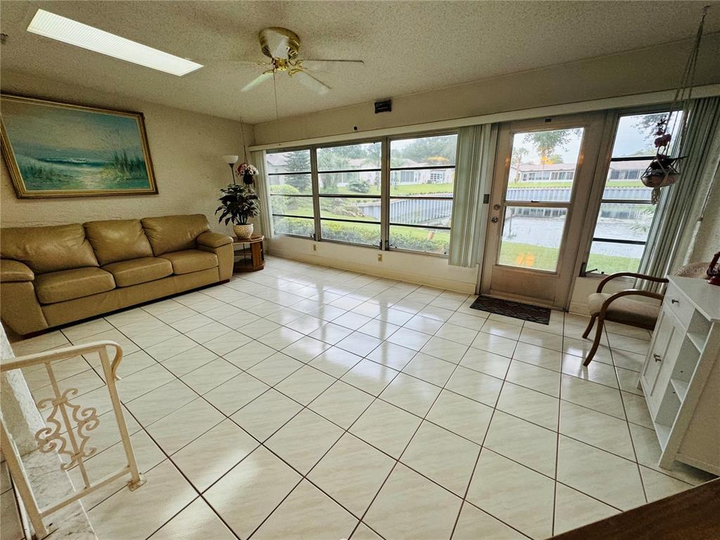 7559 Heather Walk Drive Weeki Wachee, FL 34613 - Photo 6 of 26 a living room with furniture and a flat screen tv