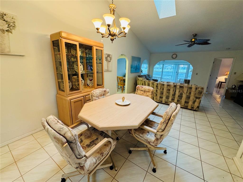 7559 Heather Walk Drive Weeki Wachee, FL 34613 - Photo 8 of 26 a view of a dining room with furniture and chandelier