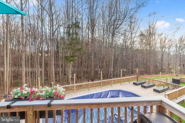 a dining room with wooden floor and a window